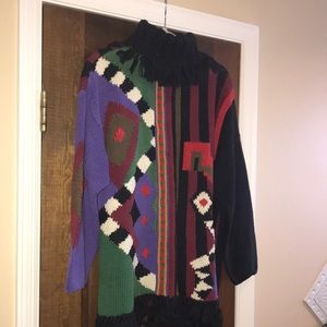 Turtle neck sweater tunic with fringe around neck and bottom of sweater…